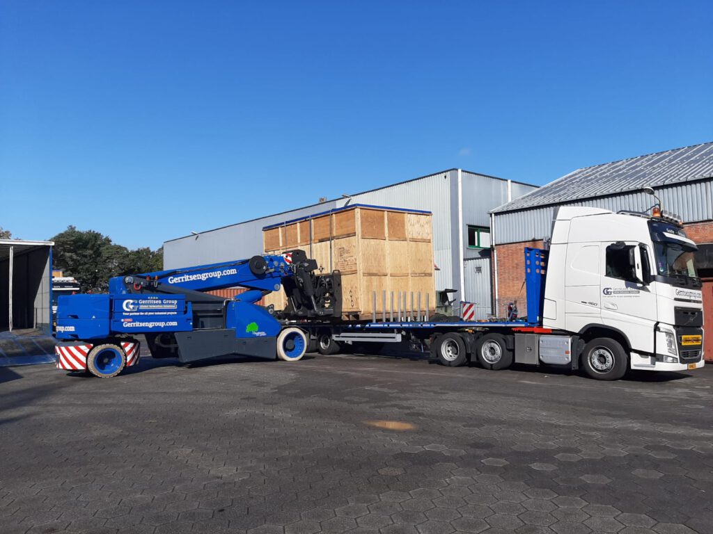 Custom crate being loaded on truck with JMG pick and carry crane. 
