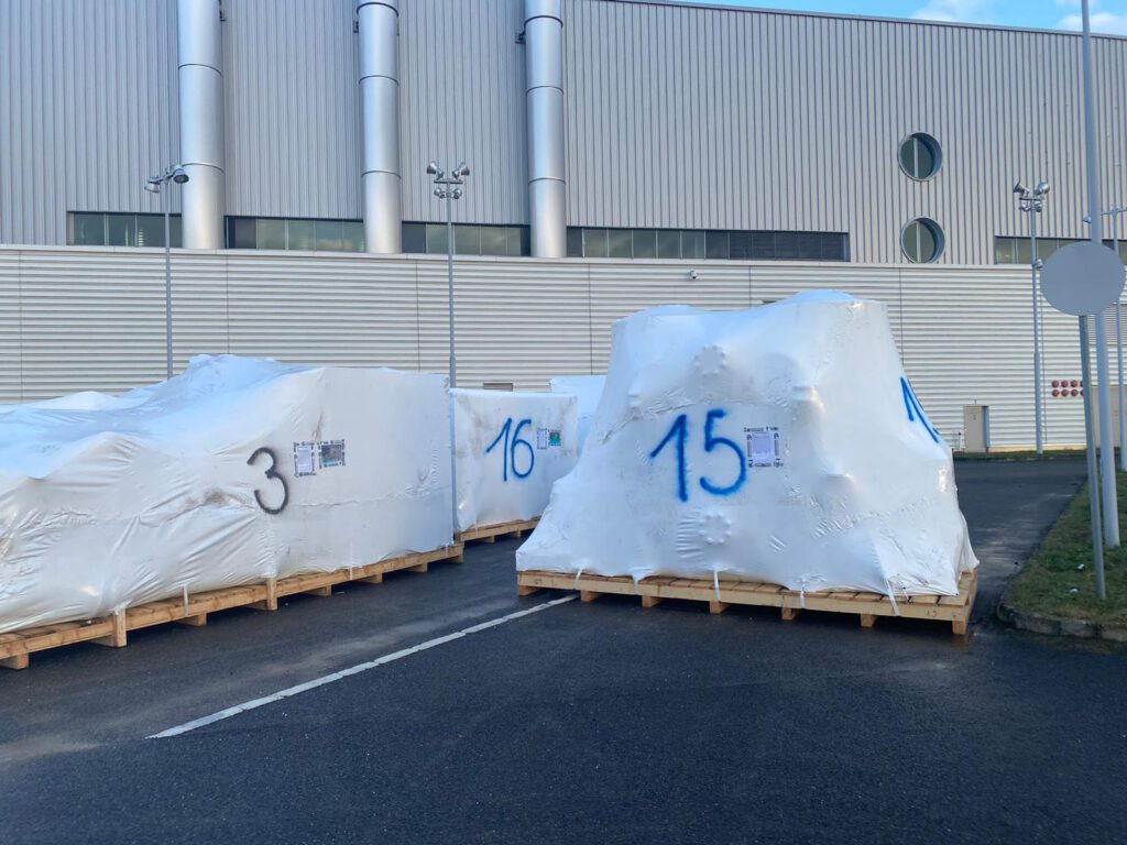 Schrinkwrapped machines on custom skids. 